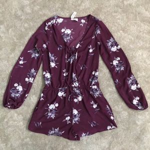 Purple Long sleeve romper with floral design